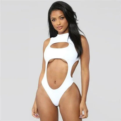 Woman wearing a white high-neck cutout one-piece swimsuit.