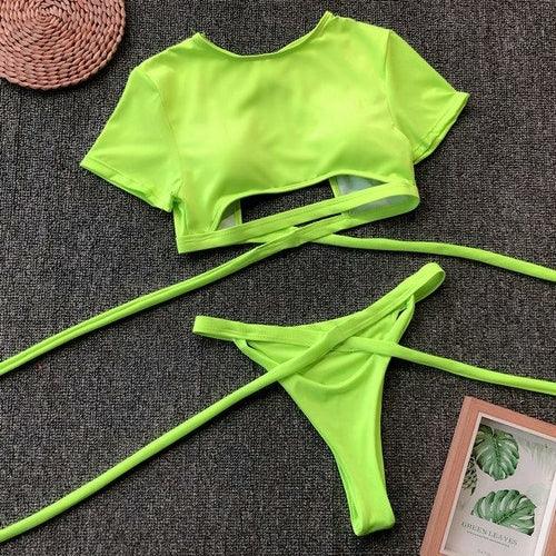 Neon lime green two-piece bikini set with crop top and wrap-around tie bottoms.